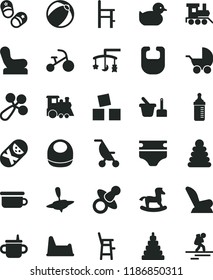 solid black flat icon set toys over the cradle vector, dummy, mug for feeding, measuring bottle, diaper, bib, baby, rattle, chair, car child seat, stroller, summer, duckling, bath ball, toy, tumbler