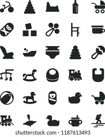 solid black flat icon set toys over the cradle vector, mug for feeding, measuring bottle, diaper, bib, baby, beanbag, rattle, car child seat, stroller, carriage, rubber duck, duckling, bath ball, a