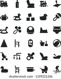 solid black flat icon set toys over the cradle vector, dummy, mug for feeding, measuring bottle, diaper, baby bib, beanbag, rattle, chair, car child seat, stroller, summer, rubber duck, duckling, a