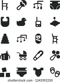 Solid Black Vector Icon Set - toys over the cradle vector, cot, measuring cup for feeding, diaper, nappy, bib, Child T shirt, beanbag, baby rattle, carriage, safety pin, duckling, stacking rings