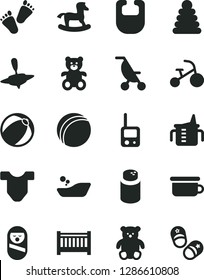 Solid Black Vector Icon Set - baby cot vector, measuring cup for feeding, powder, bib, Child T shirt, summer stroller, bath ball, children's bathroom, stacking rings, roly poly doll, toy phone, yule