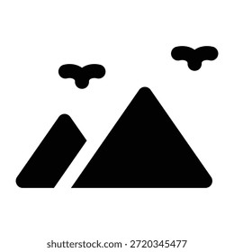 Solid glyph illustration of mountains with birds in black. Minimal style representing nature travel, adventure tourism, hiking, and outdoor exploration.