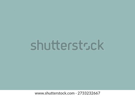 A solid seafoam green background with no objects or patterns