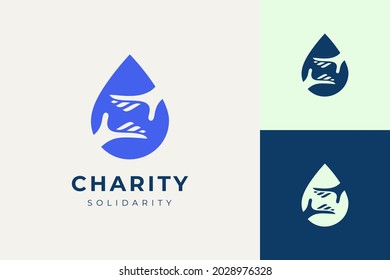 Solidarity or charity logo in hand and water drop shape