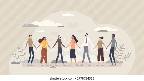 Solidarity and unity in different social ethnic groups tiny person concept. Multiracial crowd standing and holding hands as bonding and equality symbol vector illustration. Multinational connection.