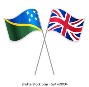 Solomon Island and British crossed flags. Solomon Islands combined with United Kingdom isolated on white. Language learning, international business or travel concept.