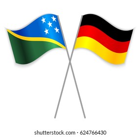 Solomon Island and German crossed flags. Solomon Islands combined with Germany isolated on white. Language learning, international business or travel concept.