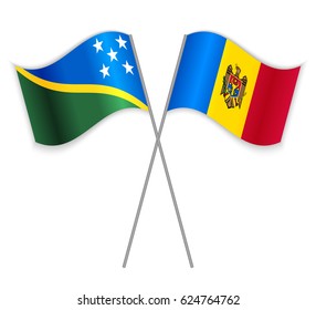 Solomon Island and Moldovan crossed flags. Solomon Islands combined with Moldova isolated on white. Language learning, international business or travel concept.
