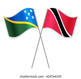 Solomon Island and Trinidadian crossed flags. Solomon Islands combined with Trinidad and Tobago isolated on white. Language learning, international business or travel concept.