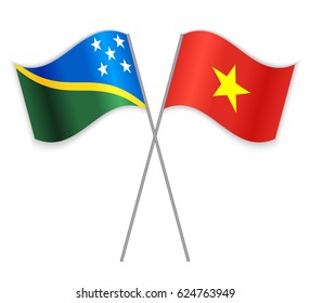 Solomon Island and Vietnamese crossed flags. Solomon Islands combined with Vietnam isolated on white. Language learning, international business or travel concept.