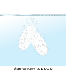 Soluble (instant) white tablets in water with bubbles