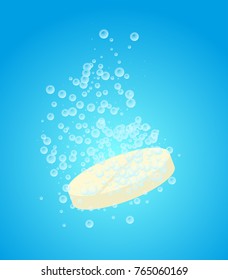 Soluble tablet on the blue background. Aspirin pill with bubbles.