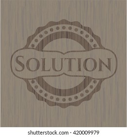 Solution badge with wooden background