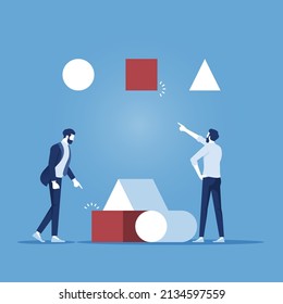 Solution, finding the right answer concept, two businessman solving a puzzle, holding a cube to put it the right hole, solving a logical problem