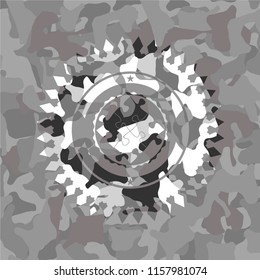 solution icon inside grey camouflaged emblem