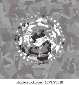 solution icon inside grey camouflaged emblem