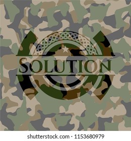 Solution written on a camouflage texture