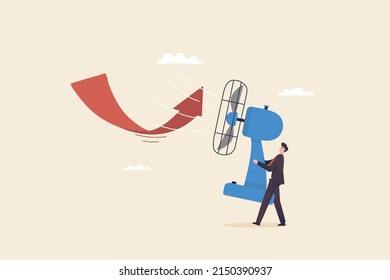 Solve problems in times of crisis, financial crisis or investing, trying to overcome or challenging business. Businessman uses a fan to change the direction of the arrow chart.