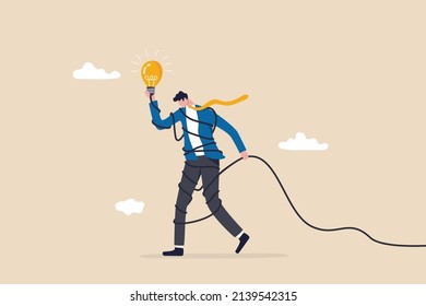 Solving complex problem, difficult idea or complicated solution, challenge or contemplation to overcome difficulty concept, frustrated businessman holding lightbulb idea while try to solve messy knot.