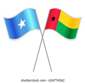 Somali and Bissau-Guinean crossed flags. Somalia combined with Guinea-Bissau isolated on white. Language learning, international business or travel concept.