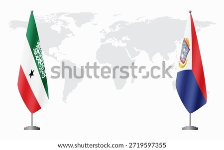 Somaliland and Sint Maarten flags for official meeting against background of world map.