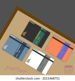 Algunos libros sobre la mesa, diseño de portadas para revistas, folletos y periódicos.