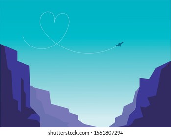 Some mountains under a beautiful blue sky where we can appreciate a heart drawn by a plane.