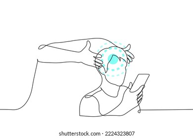 someone influences a man looking at the phone - one line drawing vector. concept internet influencer forms an opinion, headache and harm to the head from the gadget