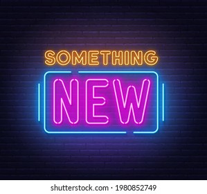 Something new neon sign on brick wall background.