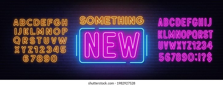 Something new neon sign on brick wall background.