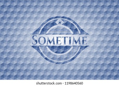 Sometime blue emblem with geometric pattern.