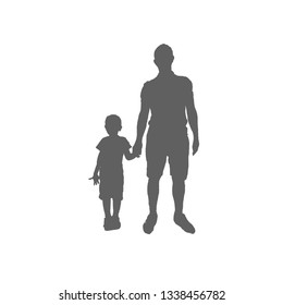 The son holds his father's hand. Father and boy silhouette.