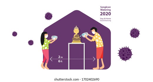 SONGKRAN, Thailand Water Festival 2020, year of COVID-19 which people should stay at home and practice social distancing to stop the outbreak, people sprinkle water onto a Buddha image at home.