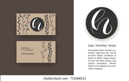 Sophisticated brand logo design. Calligraphy hand drawn letter h on a black circle. Business card template.