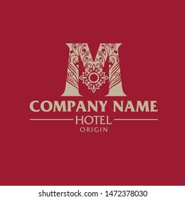 A sophisticated and high-end vector logo featuring the letter M adorned with intricate floral ornaments and classical patterns. Set against a rich burgundy red background, this elegant monogram symbolizes prestige, traditional luxury, and premium hospitality. This design is perfect for luxury hotels, boutique resorts, wedding venues, premium spa centers, high-end fashion brands, and heritage estates seeking a royal and timeless identity.