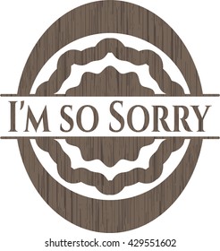 I'm so Sorry badge with wooden background