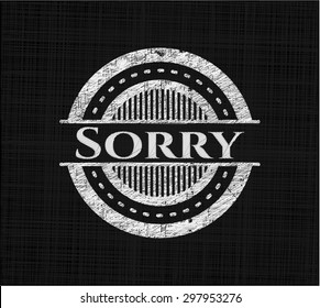 Sorry chalk emblem written on a blackboard