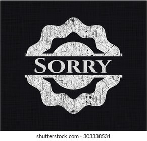 Sorry chalk emblem written on a blackboard