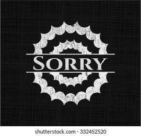 Sorry chalk emblem written on a blackboard