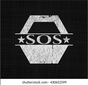 SOS on chalkboard