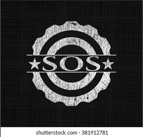 SOS written on a chalkboard