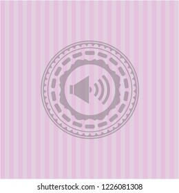 sound icon inside badge with pink background