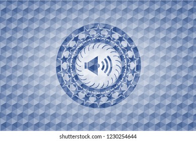 sound icon inside blue polygonal badge.
