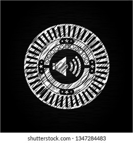 sound icon inside chalk emblem