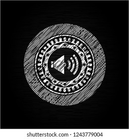 sound icon inside chalkboard emblem written on a blackboard