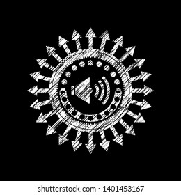 sound icon inside chalkboard emblem on black board