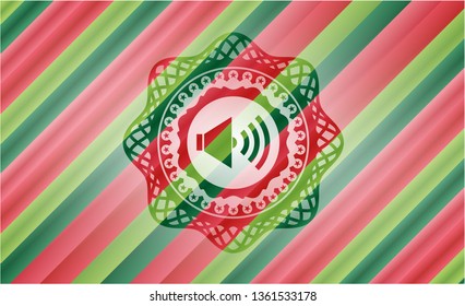 sound icon inside christmas badge background.