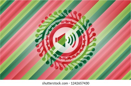 sound icon inside christmas emblem.