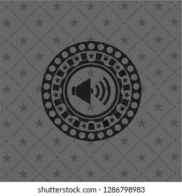 sound icon inside dark badge or emblem