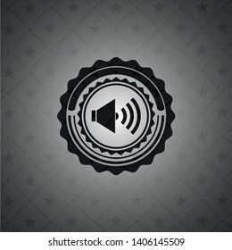 sound icon inside dark badge or emblem